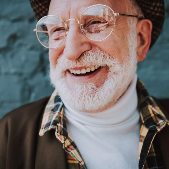 Man smiling on blue background