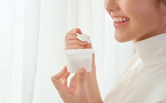 woman eating yogurt