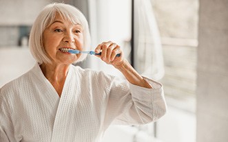 woman brushing teeth 