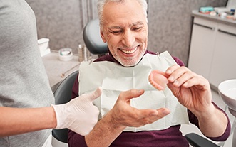 Dentures patient in Glastonbury talking to dentist